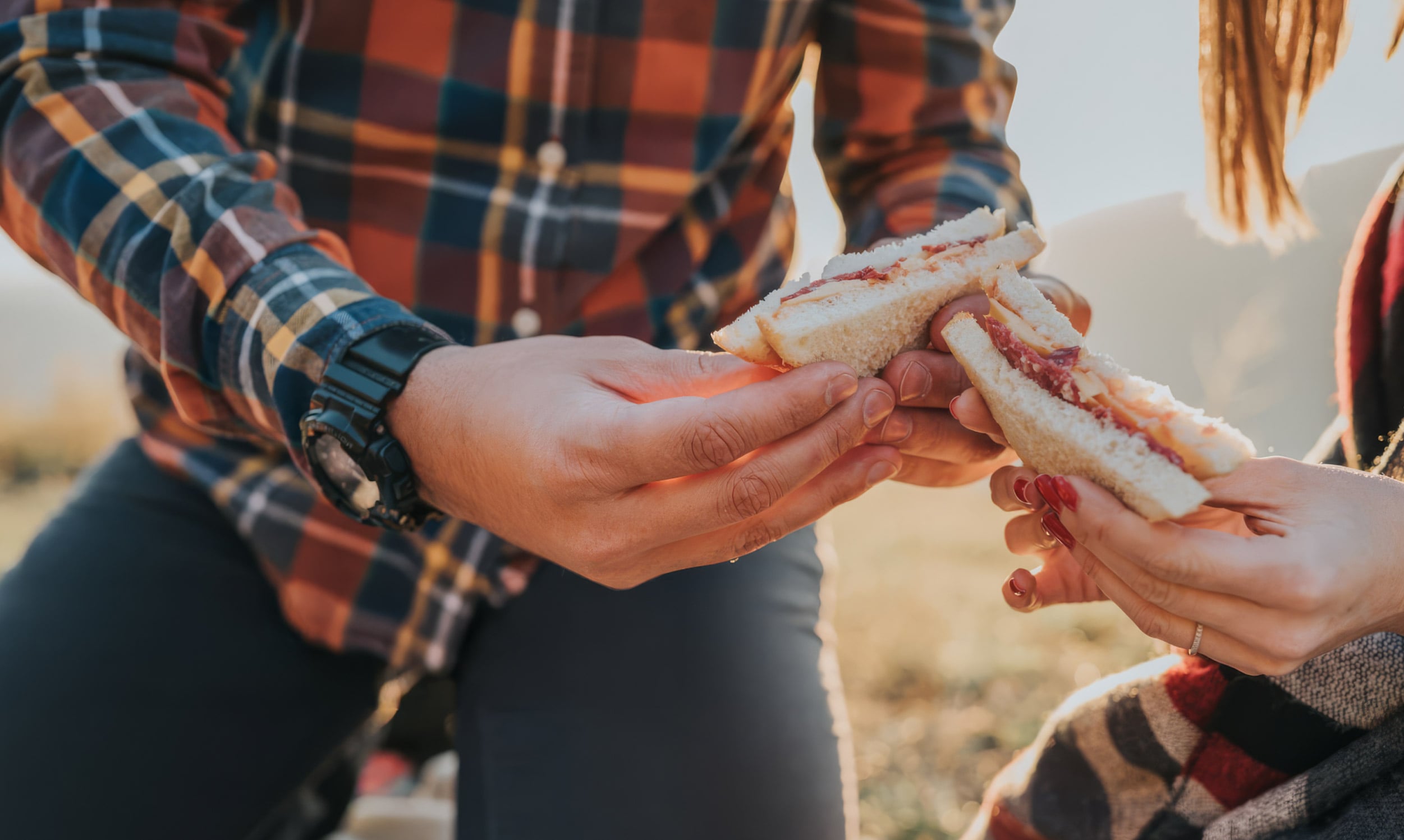 People sharing bread outdoors